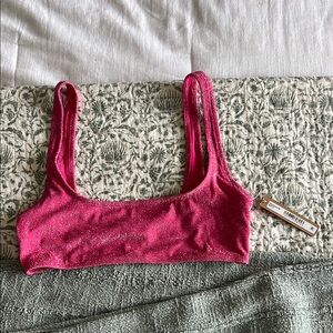 Glitter Skims Scoop Bikini Top in magenta.